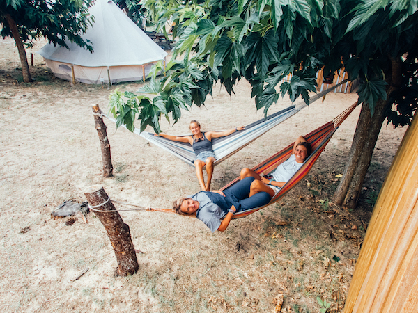 Girls Chilling in Hammock in Surf Camp in France | 600x450